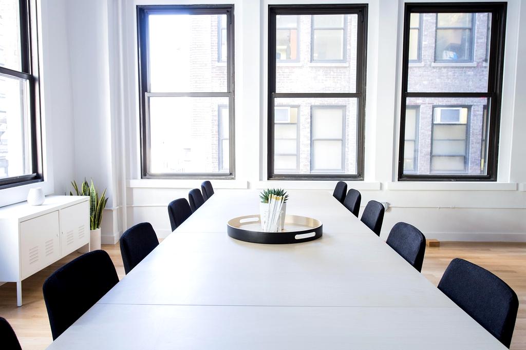 IT leaders discussing budget planning in a modern conference room